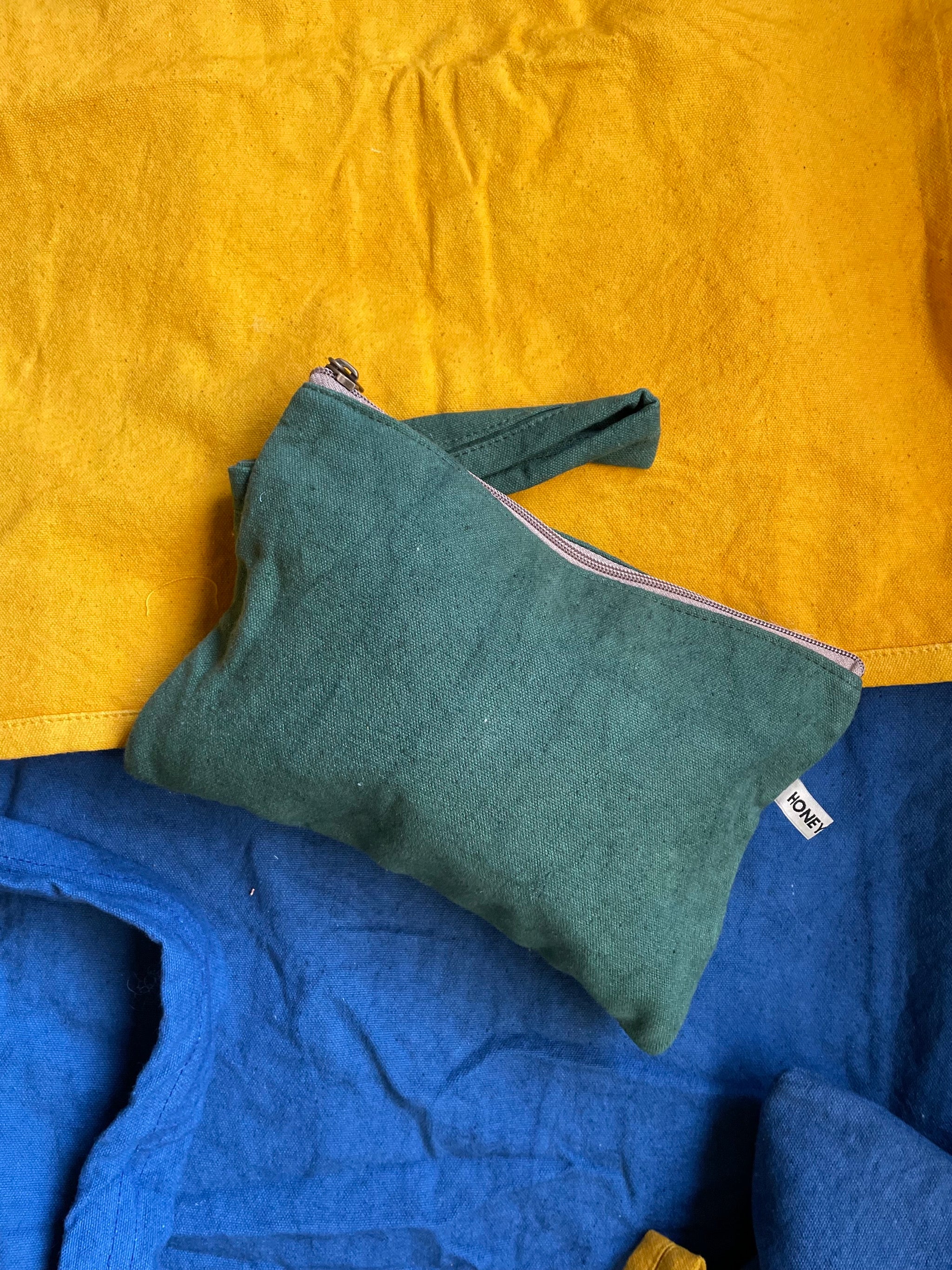 Plant dyed canvas clutch - forest green