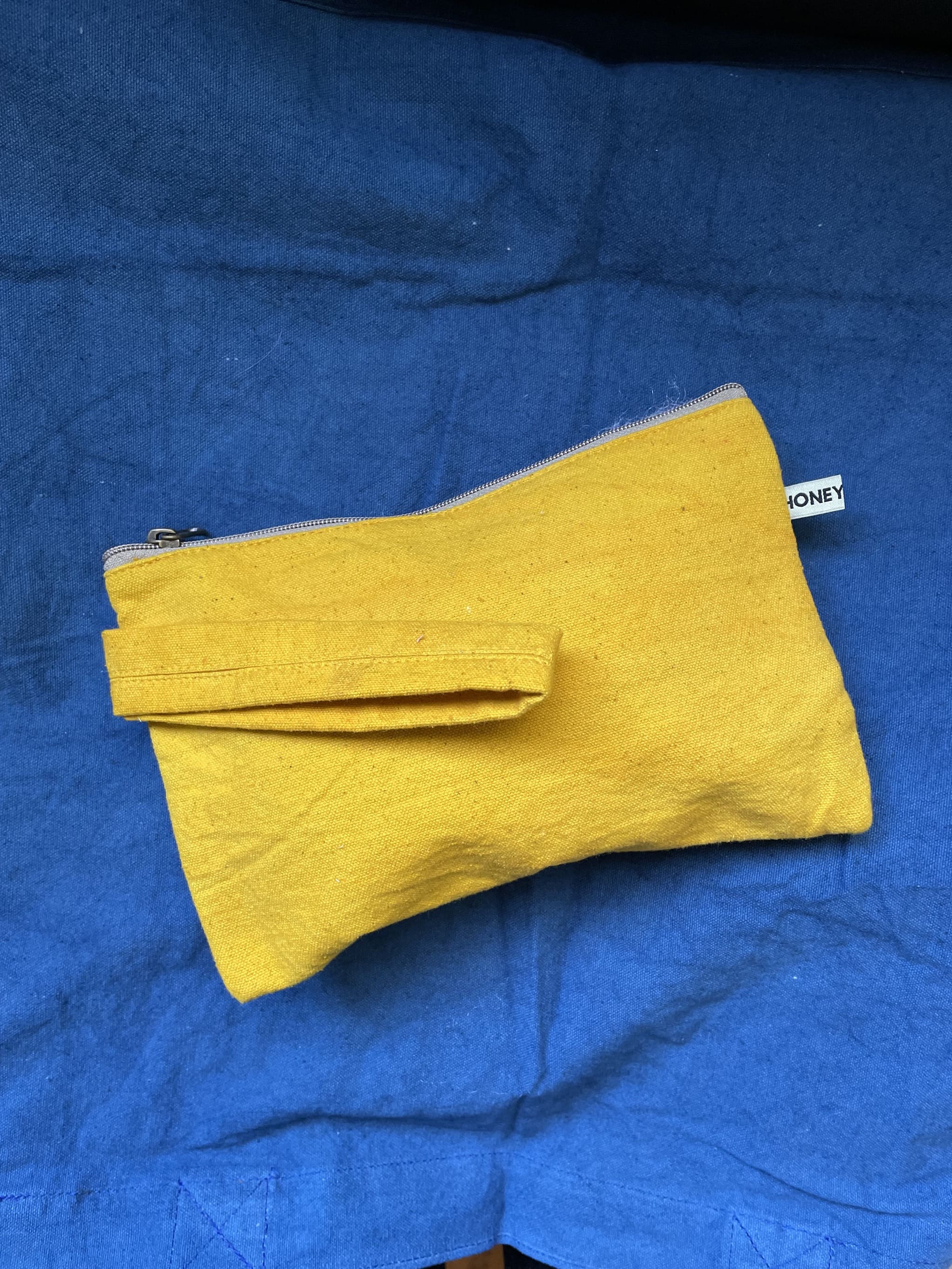 Plant dyed canvas clutch - golden